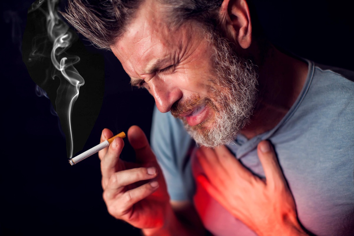 Man smokes cigarette and has problem with lungs