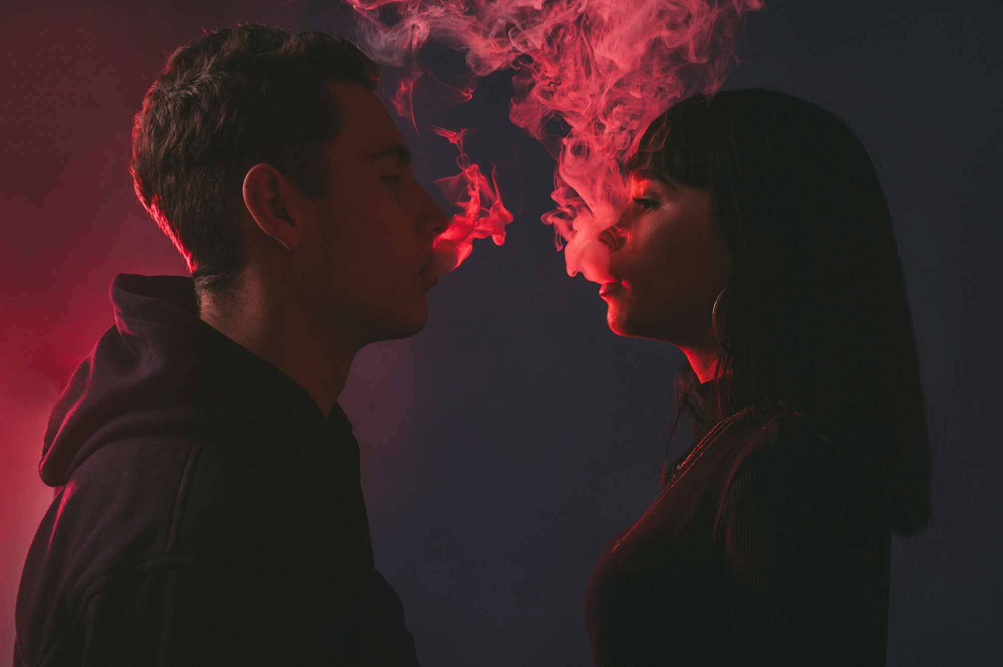vaping-boy-and-girl-together-neon