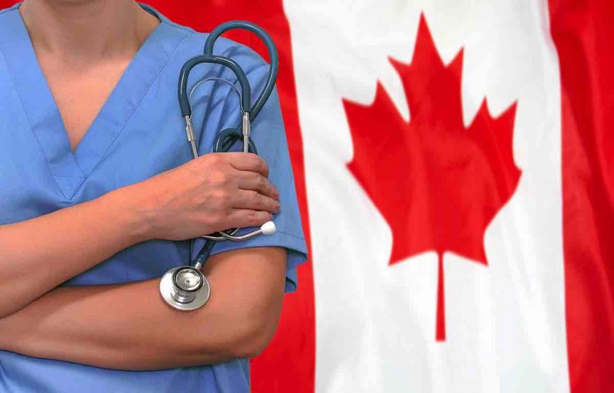 Doctor with tonometer against the background of the flag of canada