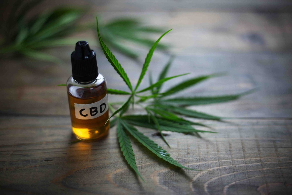 Medicinal cannabis with oil extract in a bottle