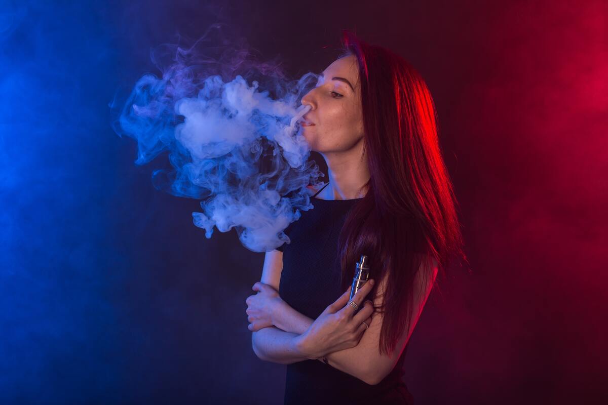 Woman vaping e-cigarette