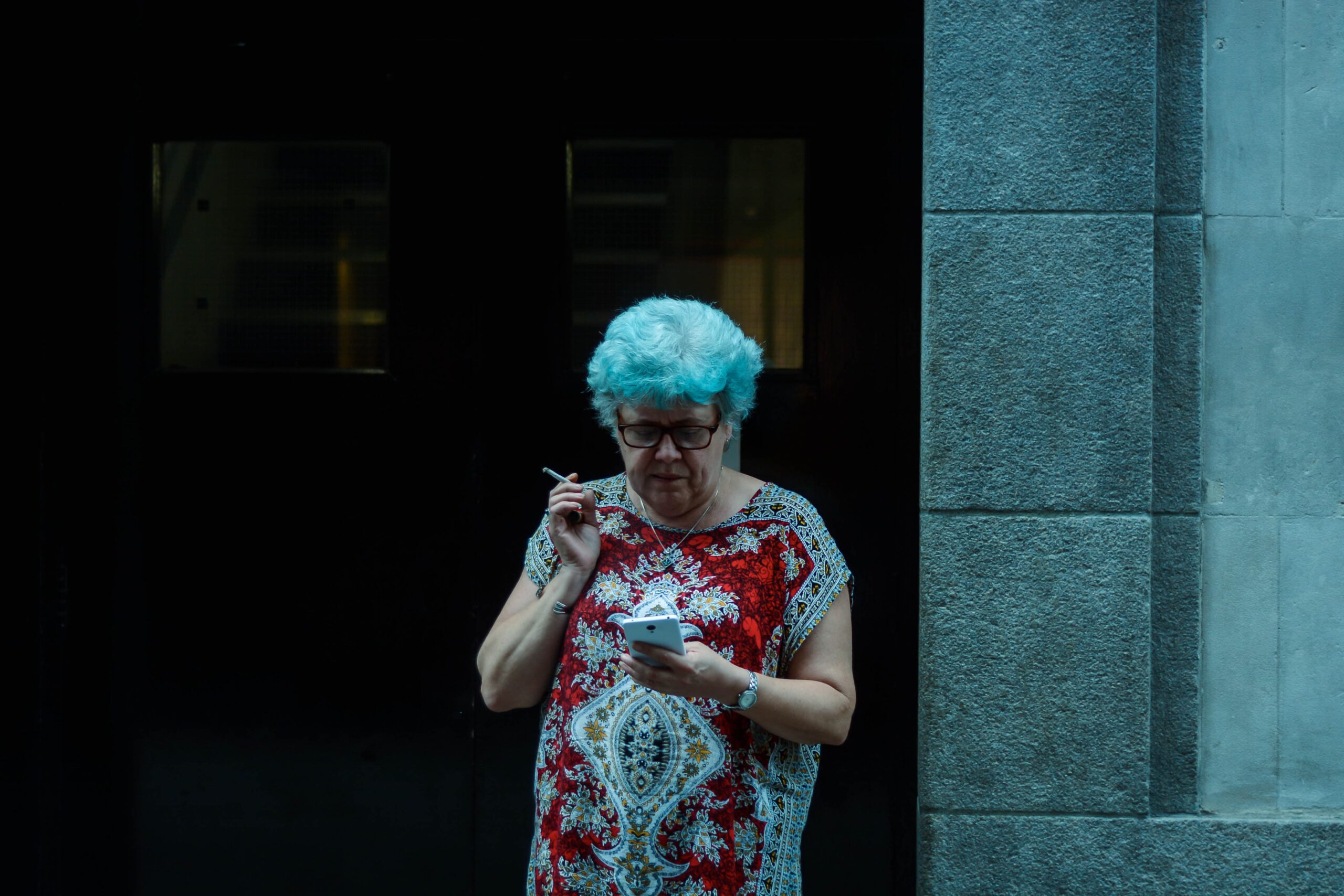 middle age woman smoes cigarette in london